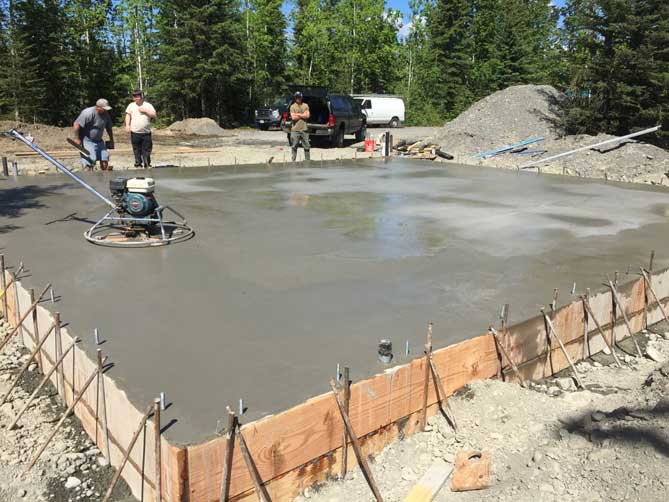 Tony Amaral Jr pouring a cement slab